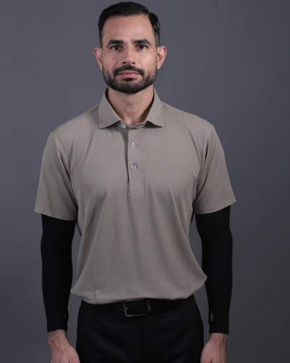 Model wearing DapperTee khaki striped polo for a premium corporate boardroom aesthetic.