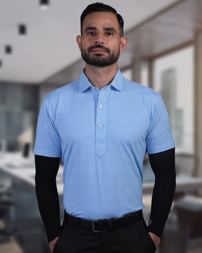 Model wearing DapperTee blue jacquard polo for a premium corporate boardroom aesthetic.