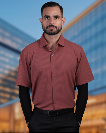 Model wearing DapperTee brown open polo for a premium corporate boardroom aesthetic.