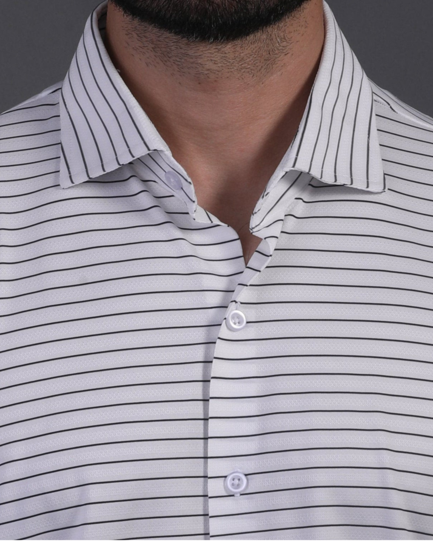 DapperTee white black stripe polo highlighting firm collar and professional tailored fit.