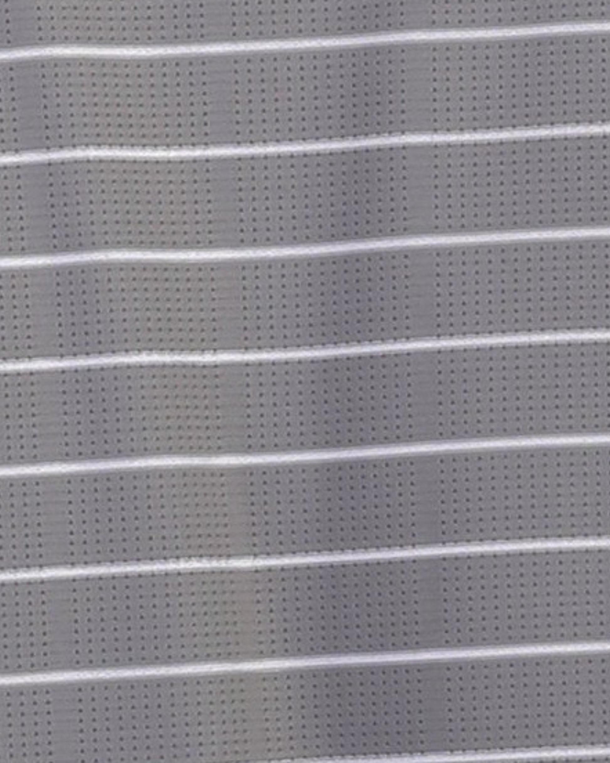 Close-up specialized polyamide fabric texture on DapperTee Prestige striped premium office polo.