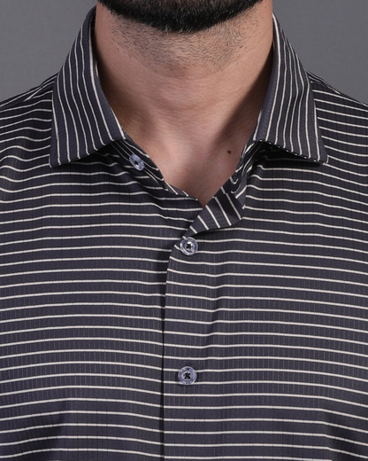 Close-up DapperTee striped polo highlighting firm collar and professional high-end tailored fit.