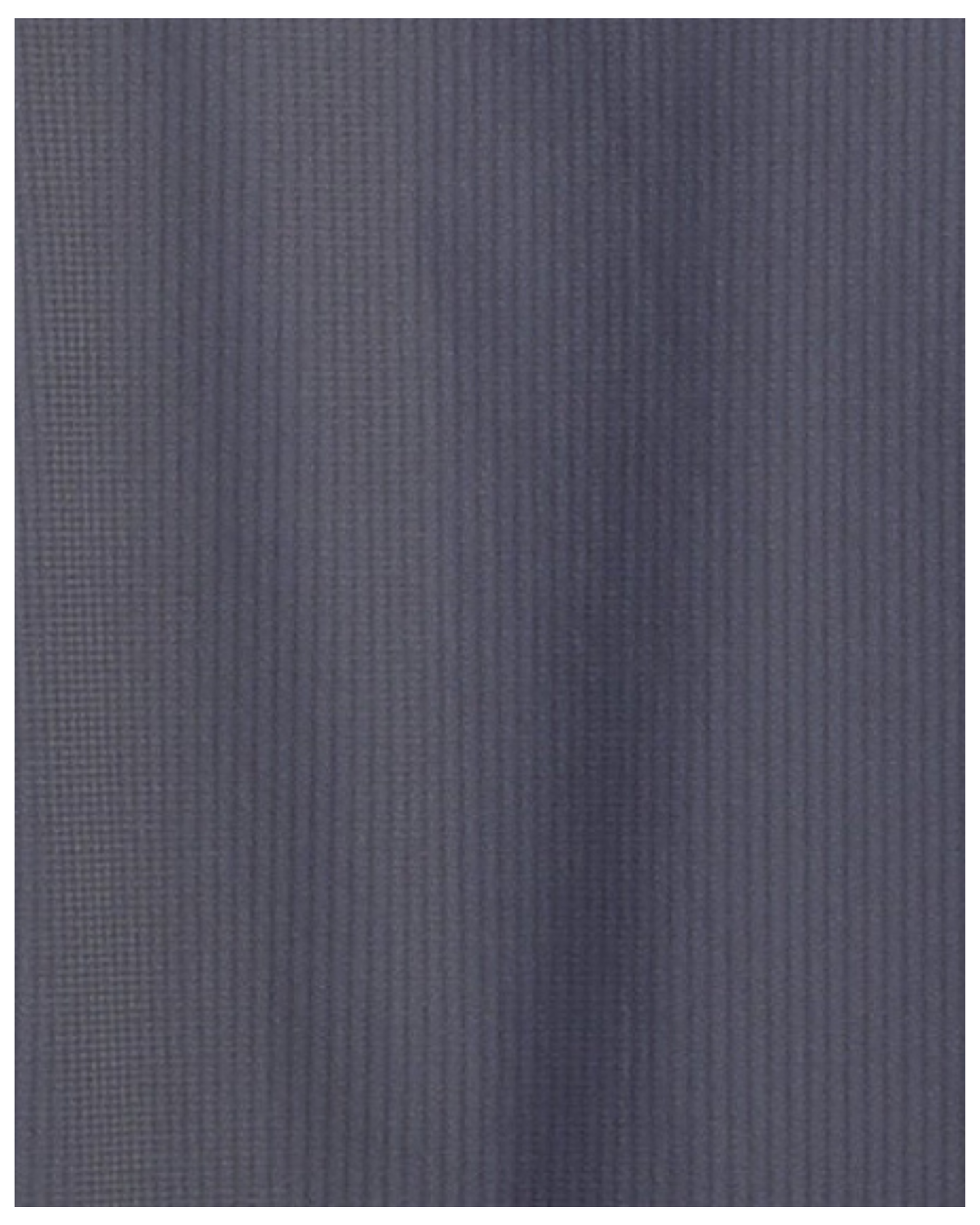 Close-up specialized jacquard polyamide fabric texture on DapperTee charcoal premium office polo.