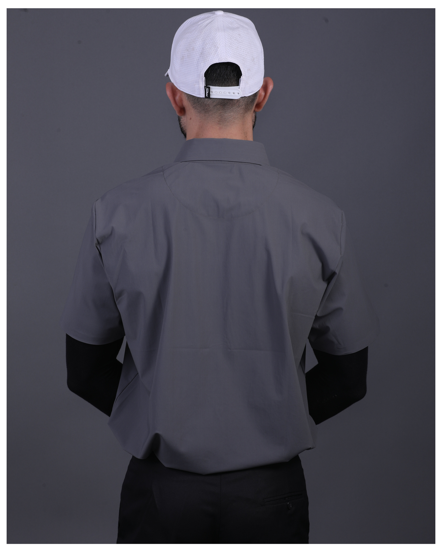 DapperTee charcoal open polo styled for high-end professional environments and corporate leadership.