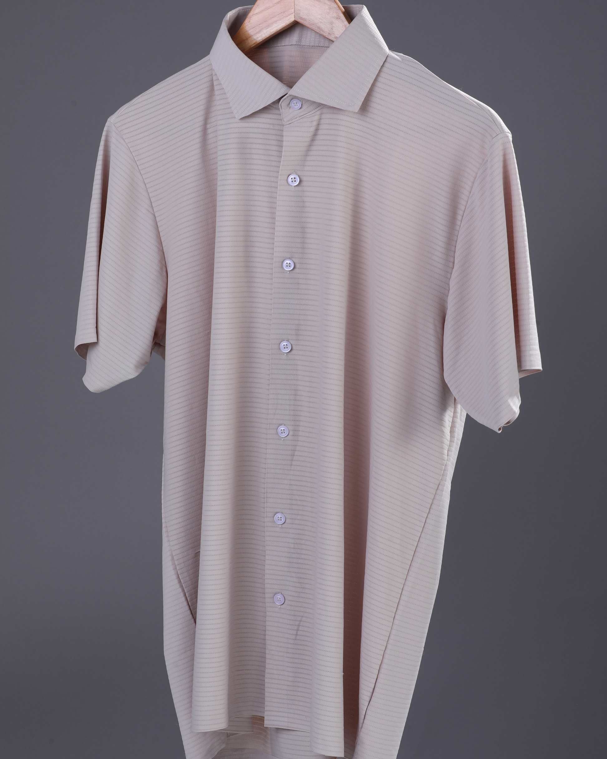 DapperTee beige open polo highlighting professional open collar and premium tailored fit.