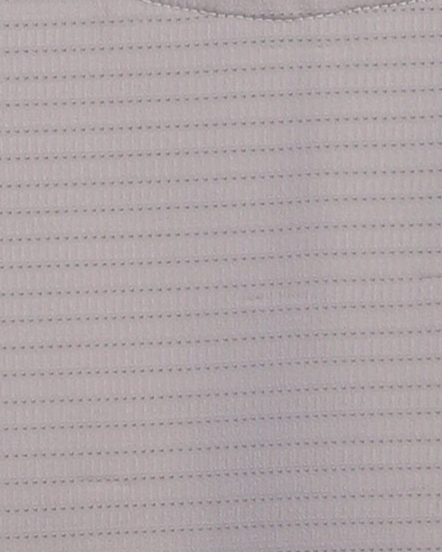 Close-up specialized jacquard polyamide fabric texture on DapperTee beige premium office polo.