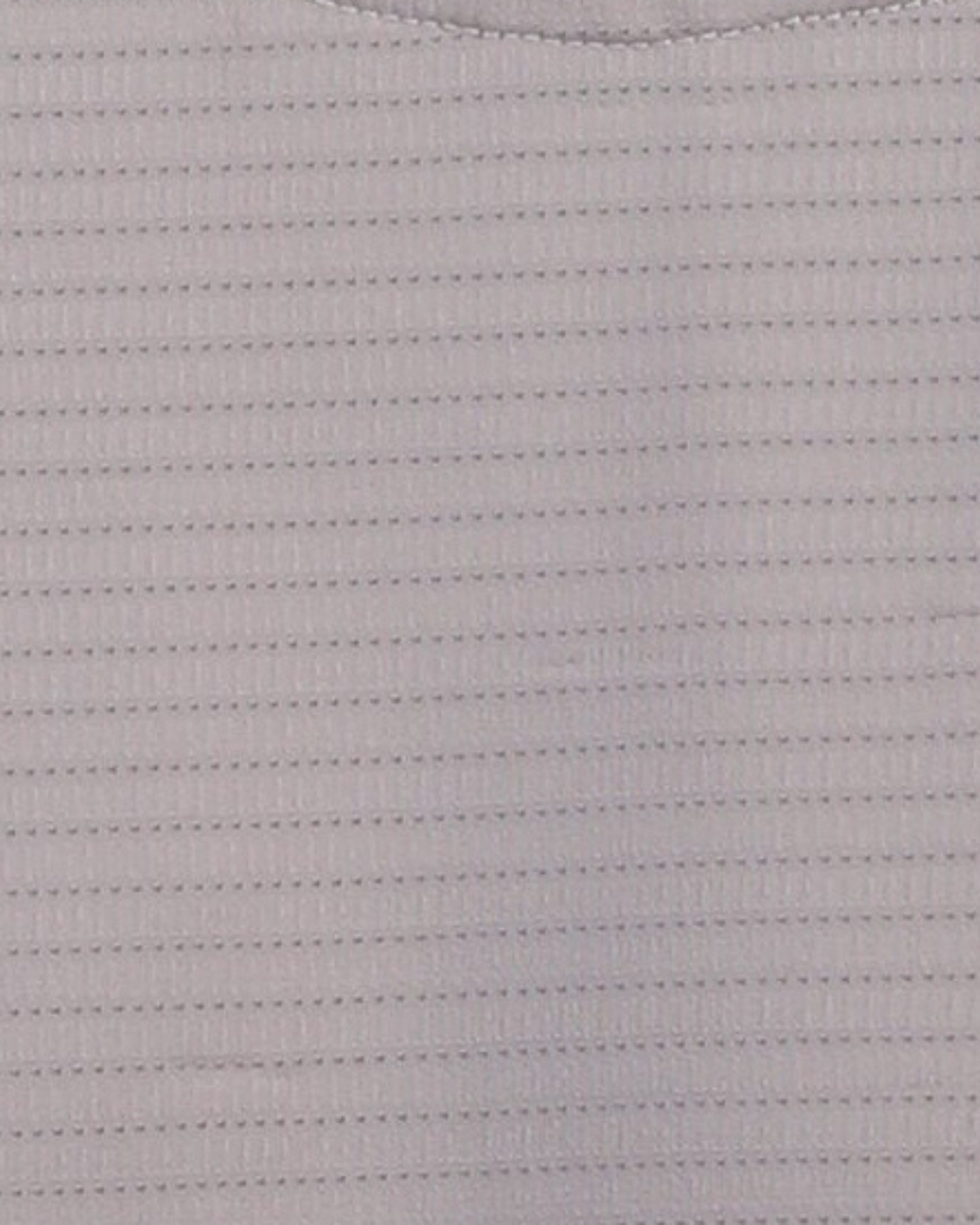 Close-up specialized jacquard polyamide fabric texture on DapperTee beige premium office polo.