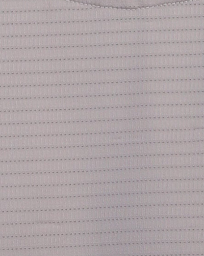 Close-up specialized jacquard polyamide fabric texture on DapperTee beige premium office polo.