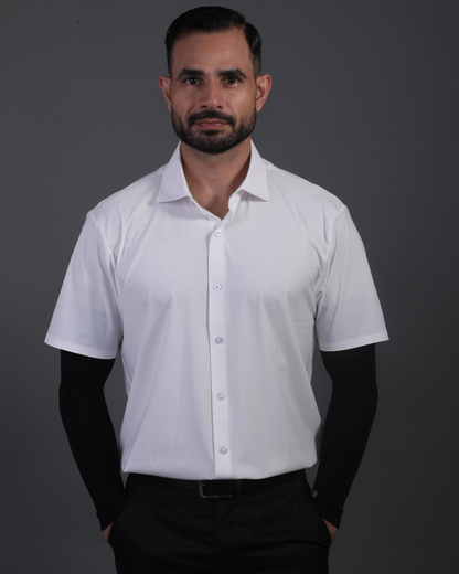 Model wearing DapperTee white open polo for a premium corporate boardroom aesthetic.