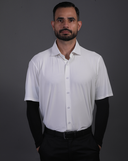 Model wearing DapperTee white open polo for a premium corporate boardroom aesthetic.