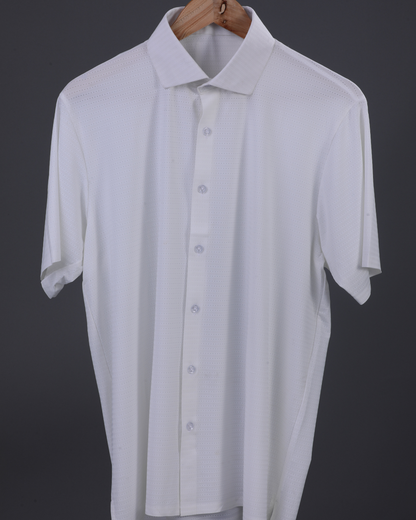 DapperTee white open polo highlighting professional open collar and premium tailored fit.