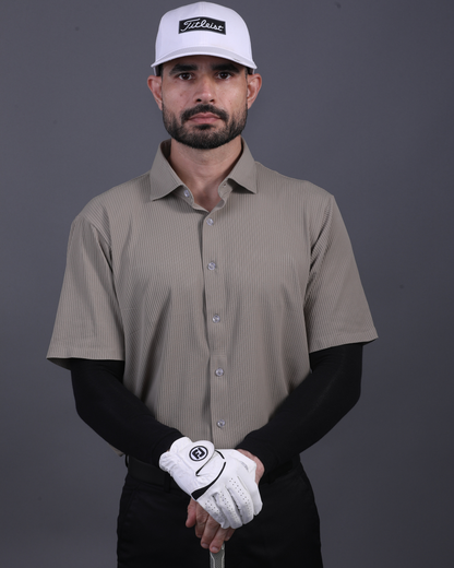 Model wearing DapperTee khaki open polo for a premium corporate boardroom aesthetic.