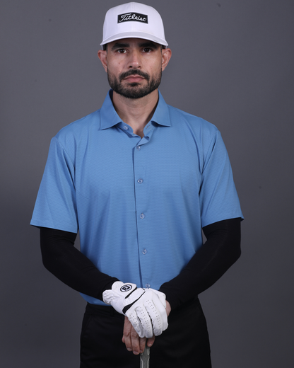 Model wearing DapperTee blue open polo for a premium corporate boardroom aesthetic.