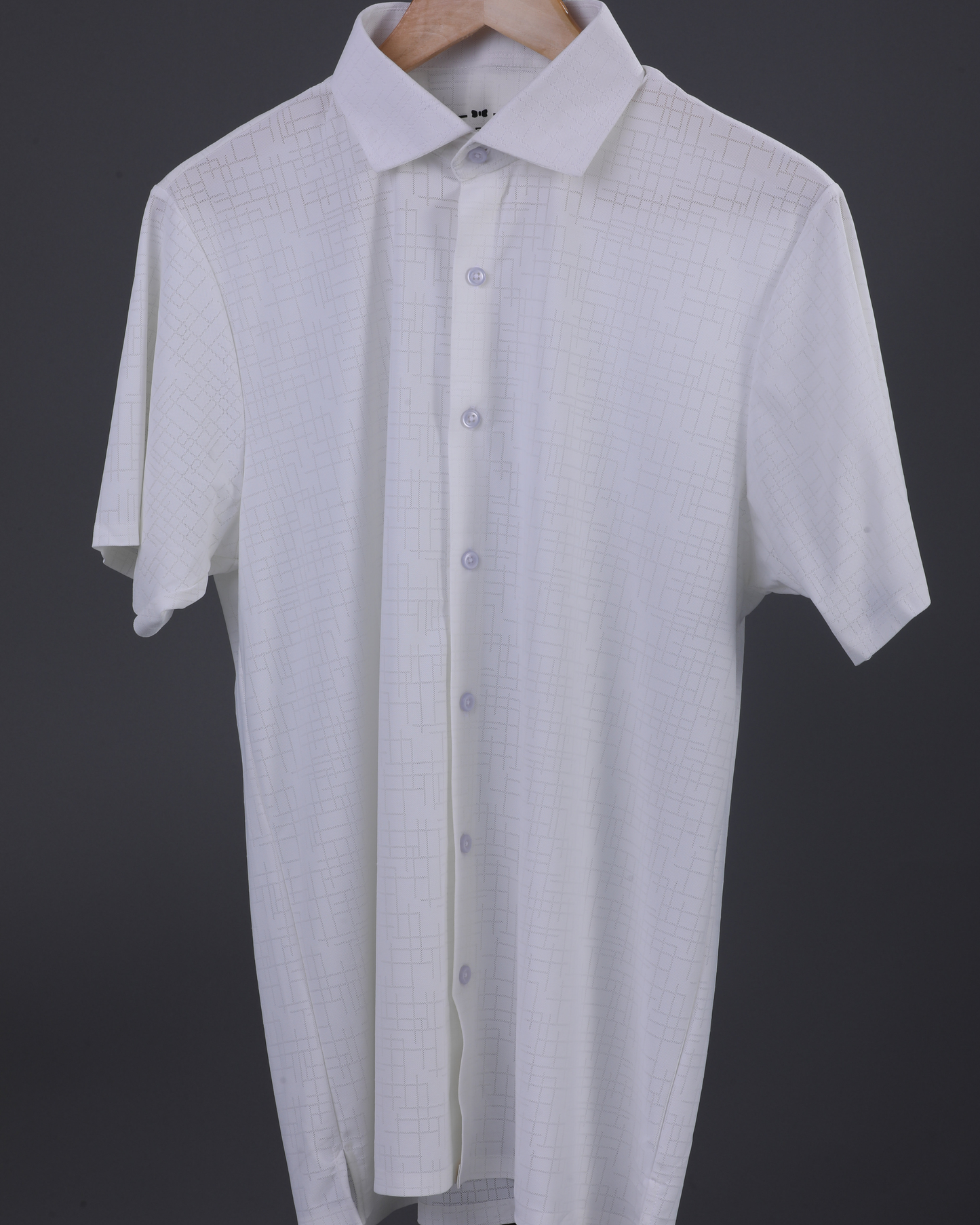 DapperTee white open polo highlighting professional open collar and premium tailored fit.