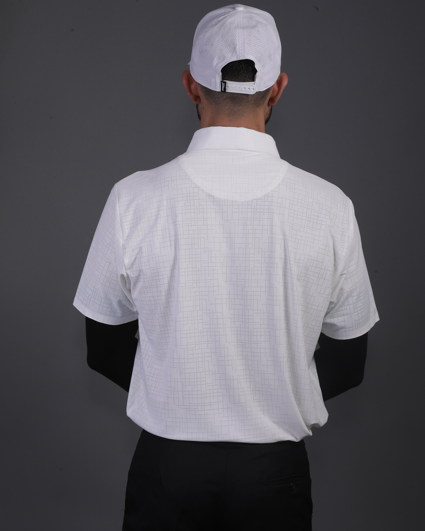 DapperTee white open polo styled for high-end professional environments and corporate leadership.