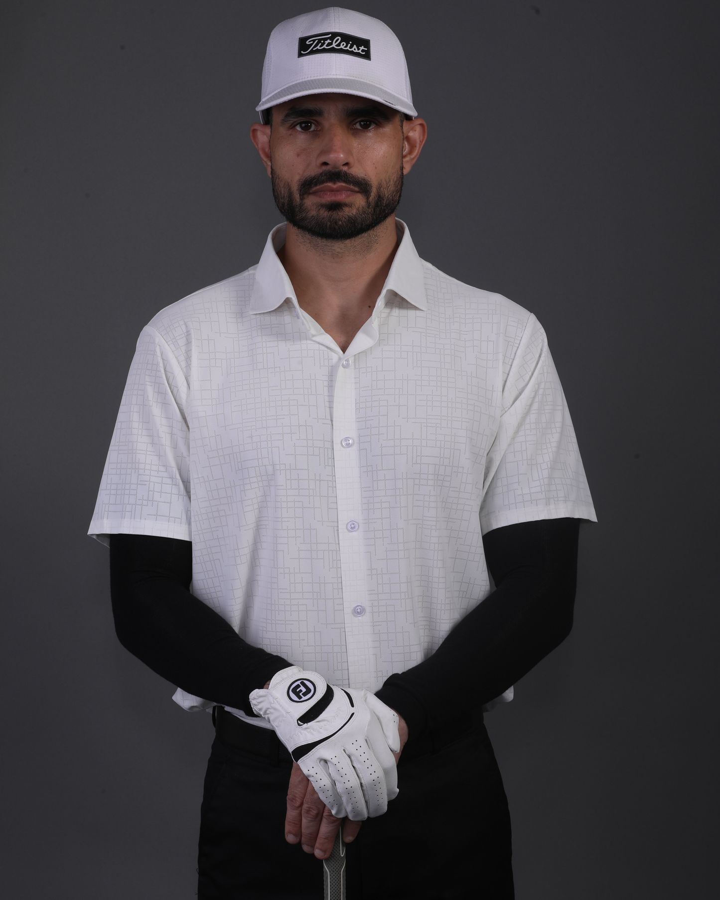 Men's DapperTee white open polo breathable polyamide fabric for professional office environments.