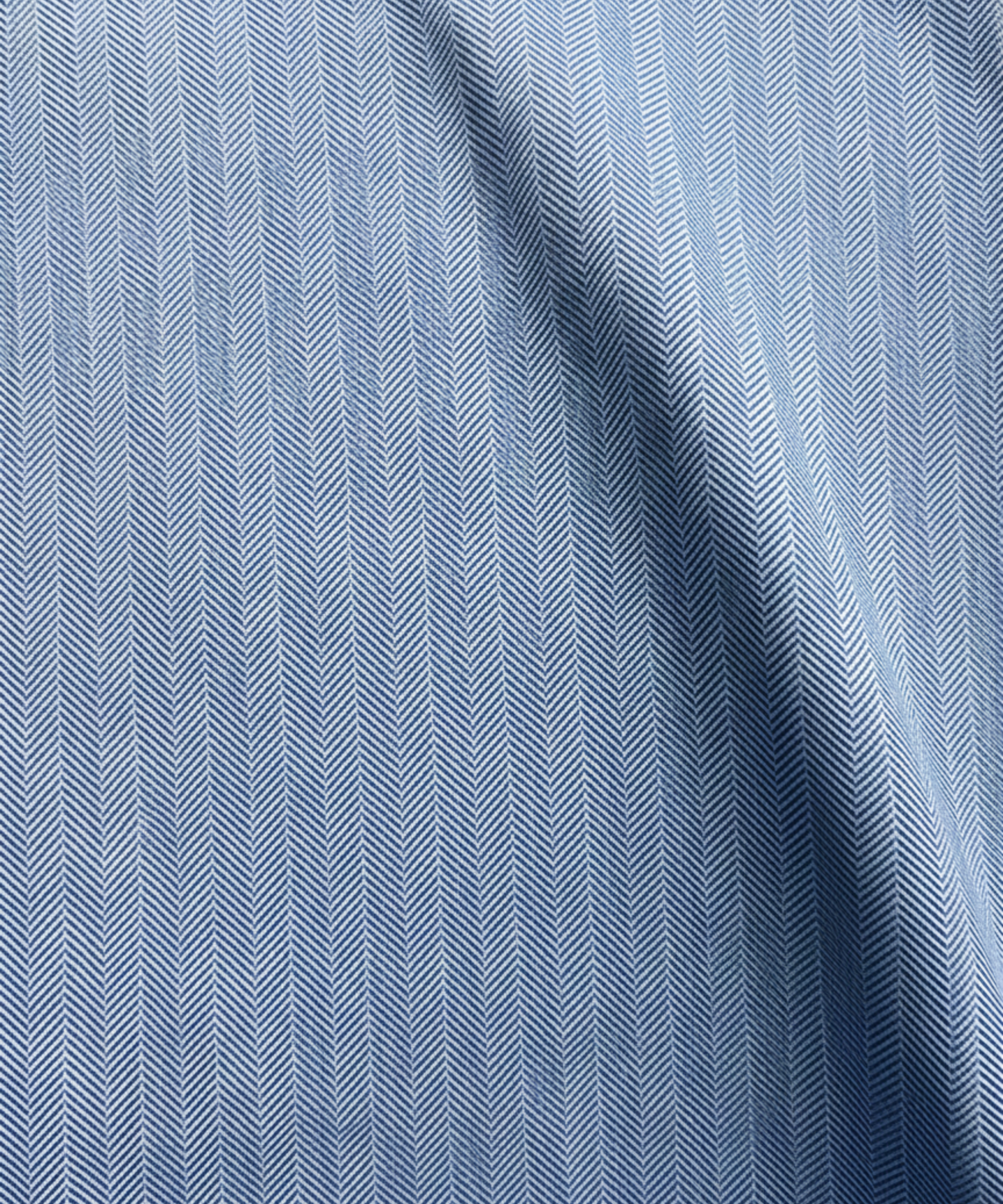 Close-up specialized polyamide fabric texture on DapperTee Austrian Snow Peak office polo.