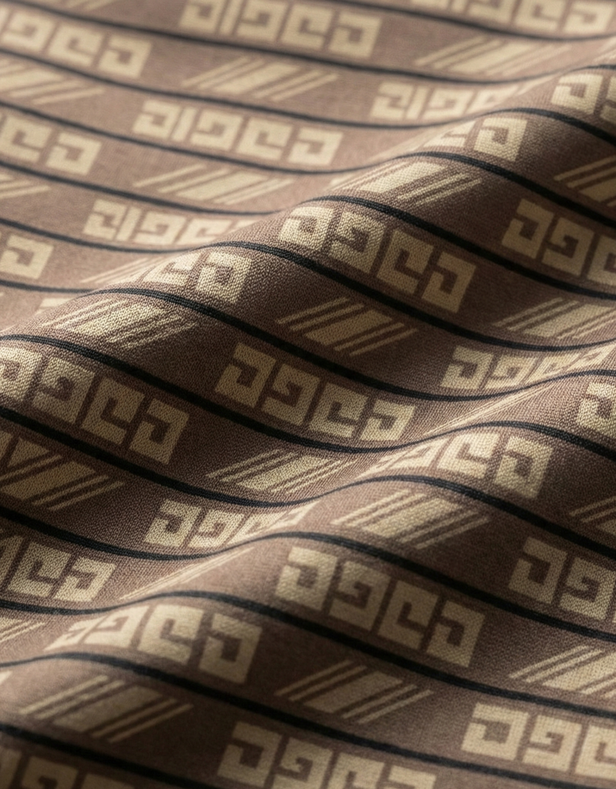Close-up specialized jacquard polyamide fabric texture on DapperTee brown flex office polo.