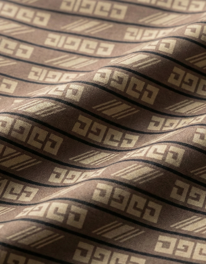 Close-up specialized jacquard polyamide fabric texture on DapperTee brown flex office polo.