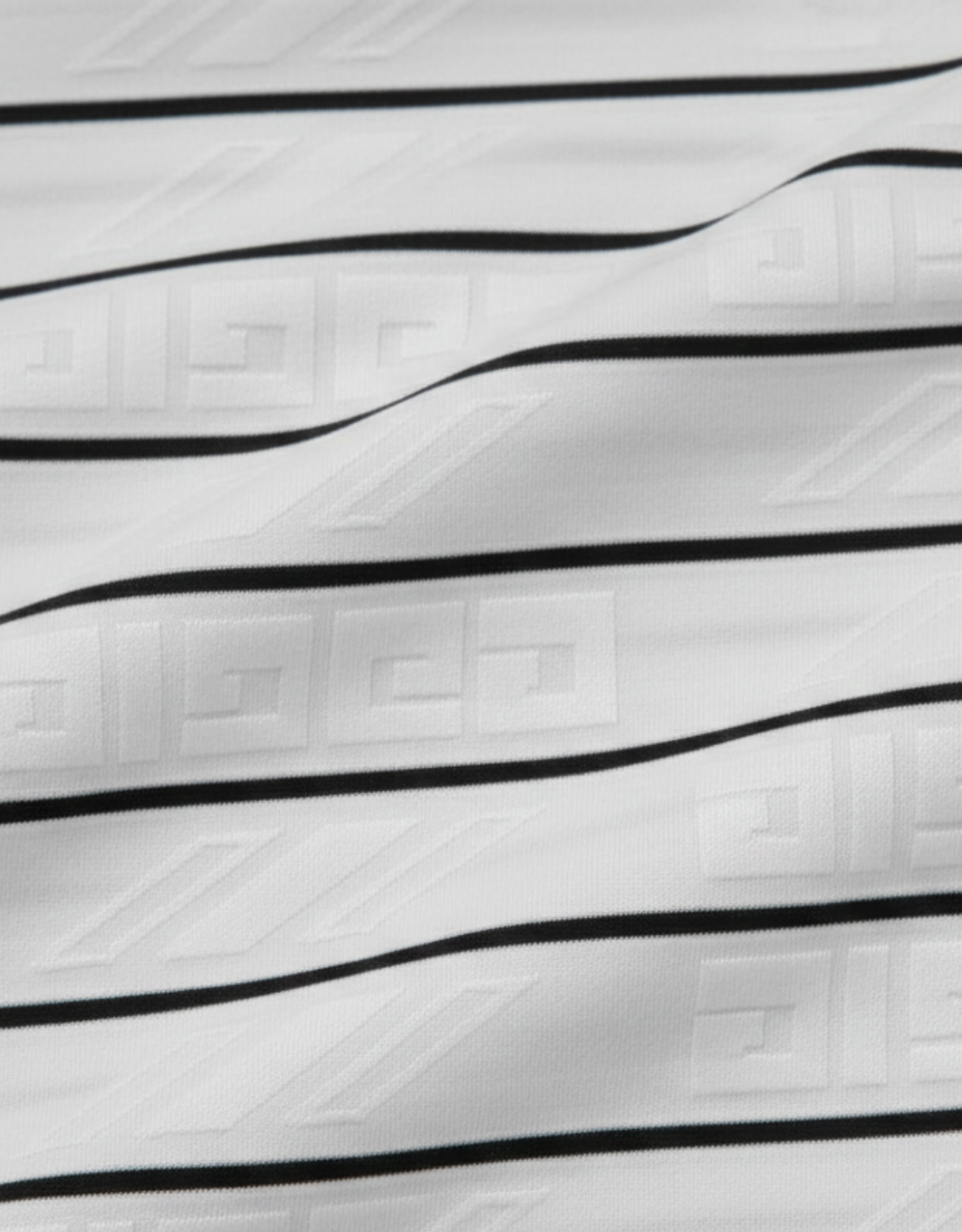 Close-up specialized jacquard polyamide fabric texture on DapperTee Italian designer striped polo.