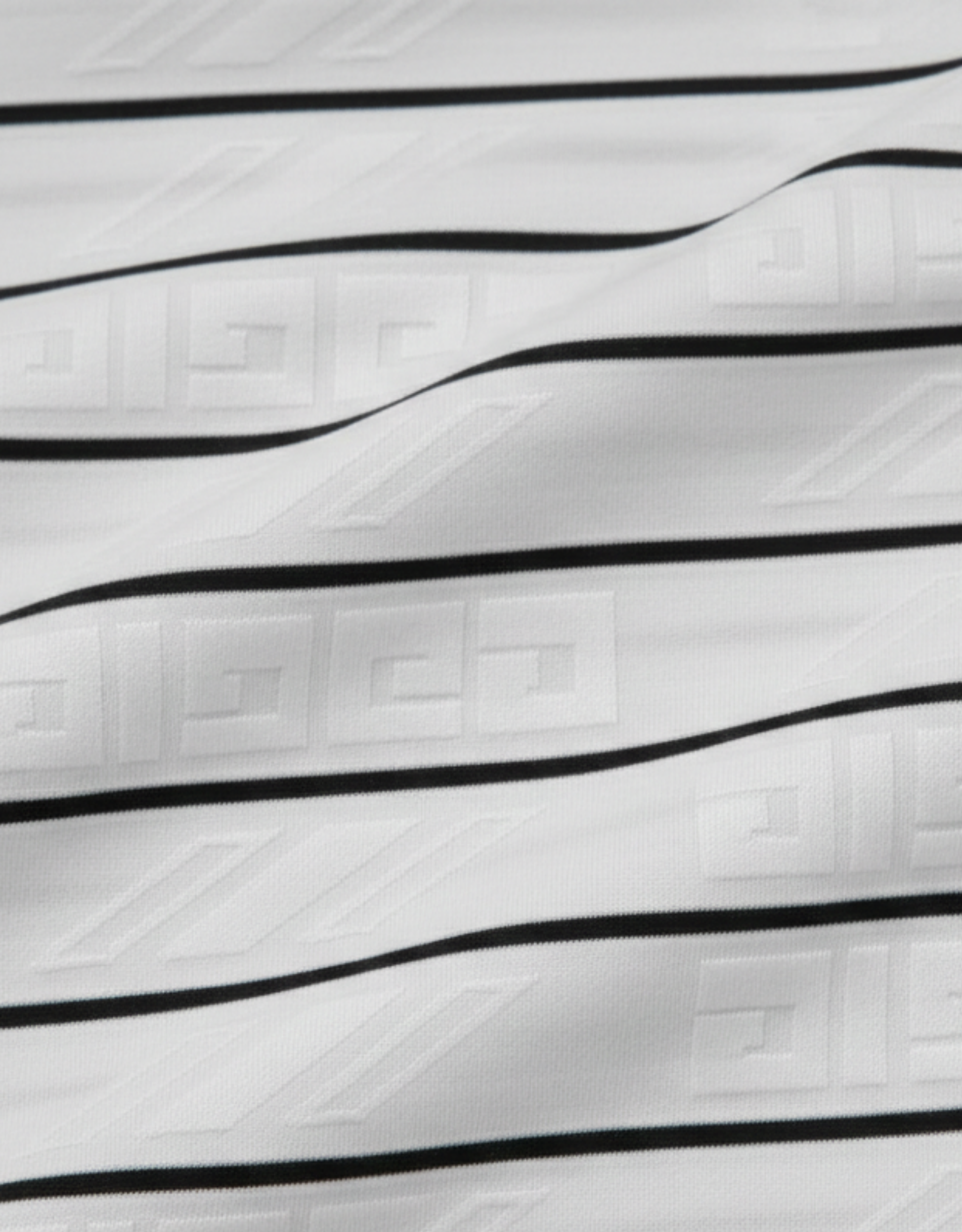 Close-up specialized jacquard polyamide fabric texture on DapperTee Italian designer striped polo.