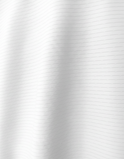 Close-up specialized jacquard polyamide fabric texture on DapperTee Icelandic white striper polo.