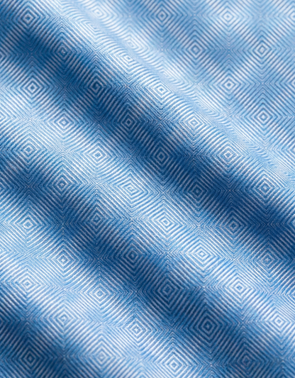 Close-up specialized polyamide fabric texture on DapperTee Norway Blue squares office polo.