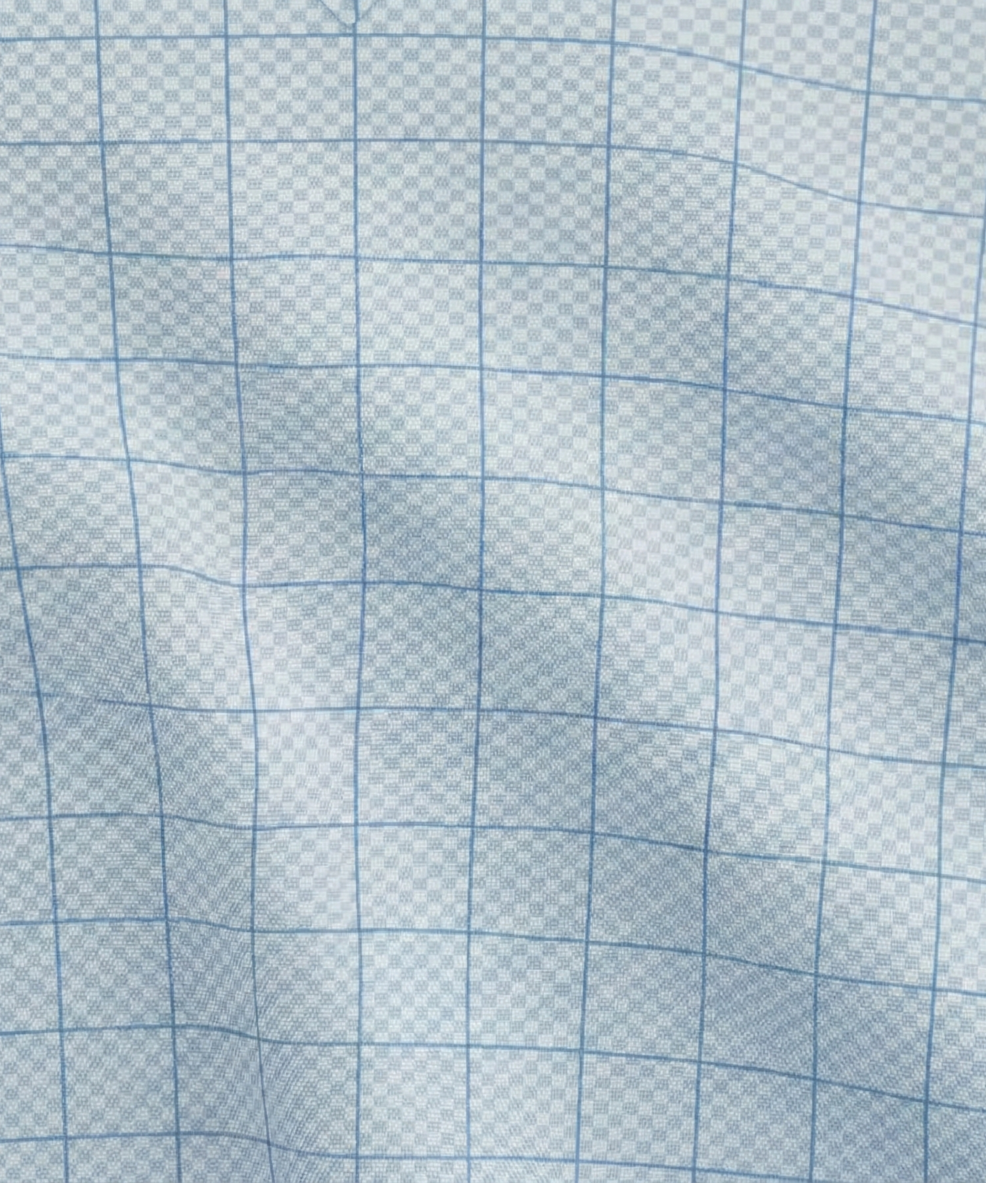 Close-up specialized polyamide fabric texture on DapperTee German Chancellor checked office polo.