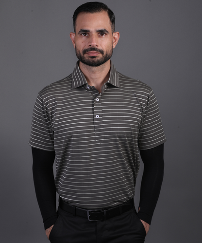 Model wearing DapperTee black striped polo for a premium corporate boardroom aesthetic.