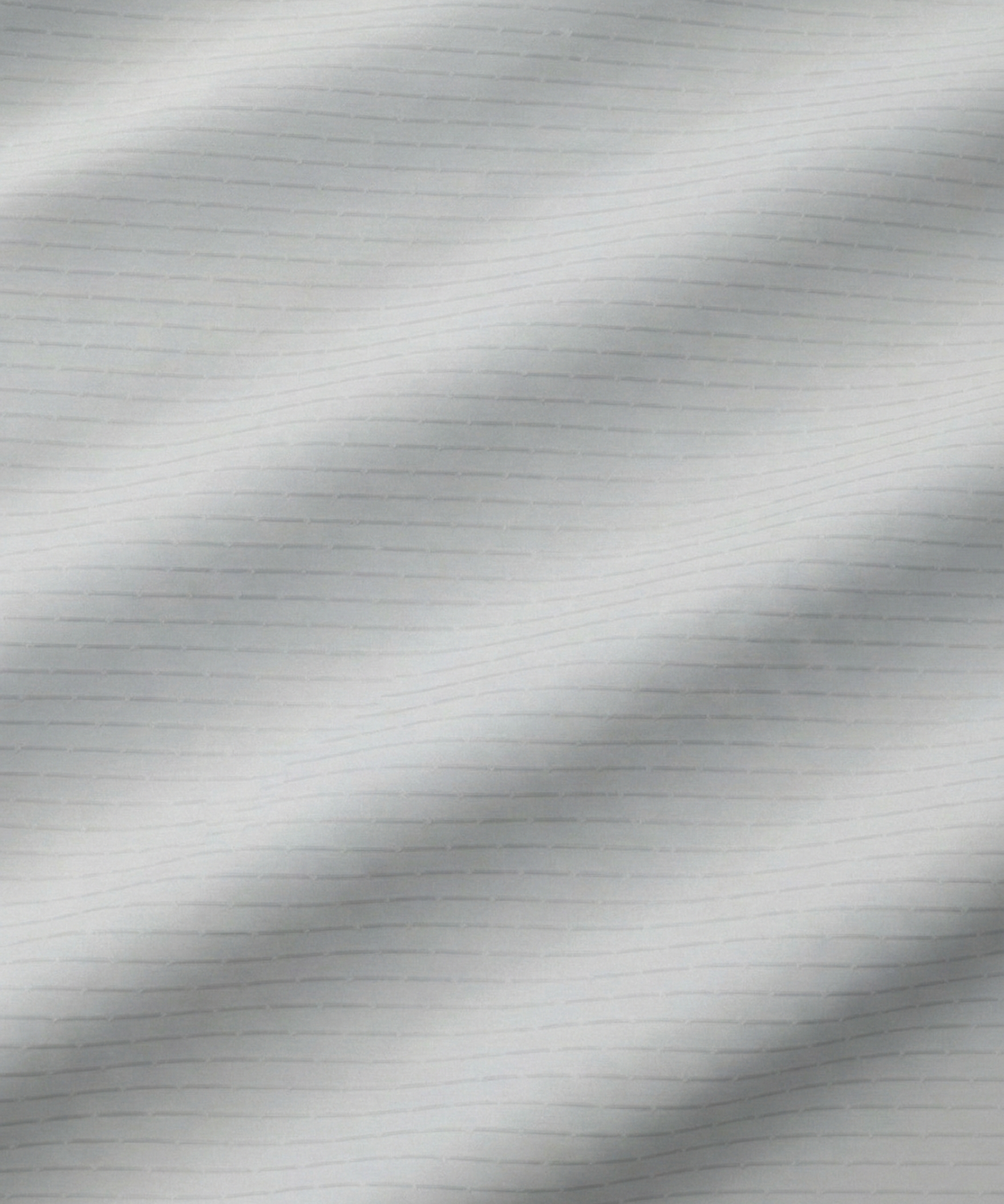 Close-up specialized jacquard polyamide fabric texture on DapperTee Icelandic white striper shirt.