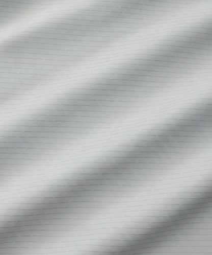 Close-up specialized jacquard polyamide fabric texture on DapperTee Icelandic white striper shirt.