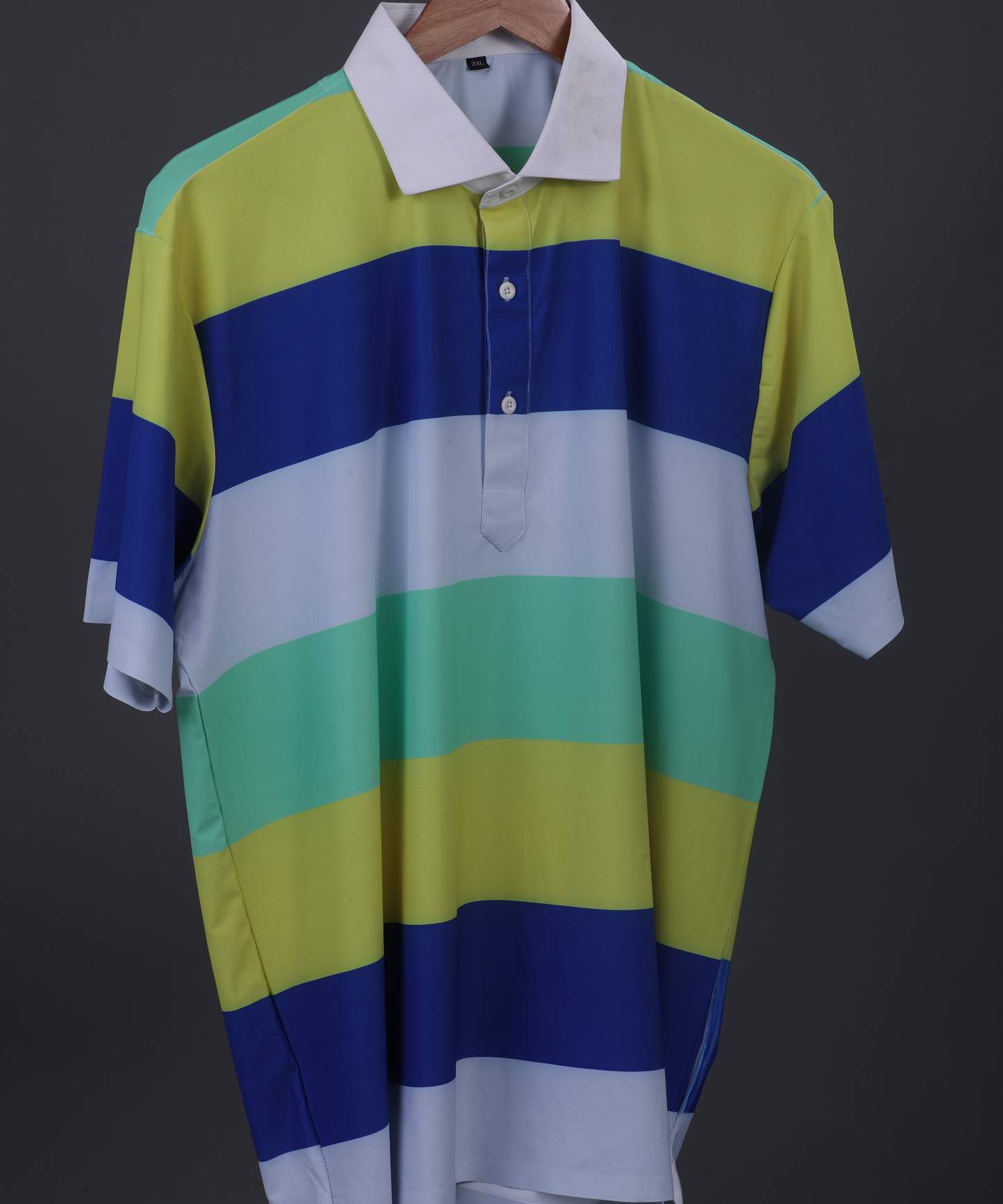 DapperTee yellow blue stripe golf polo highlighting firm collar and relaxed fit design.