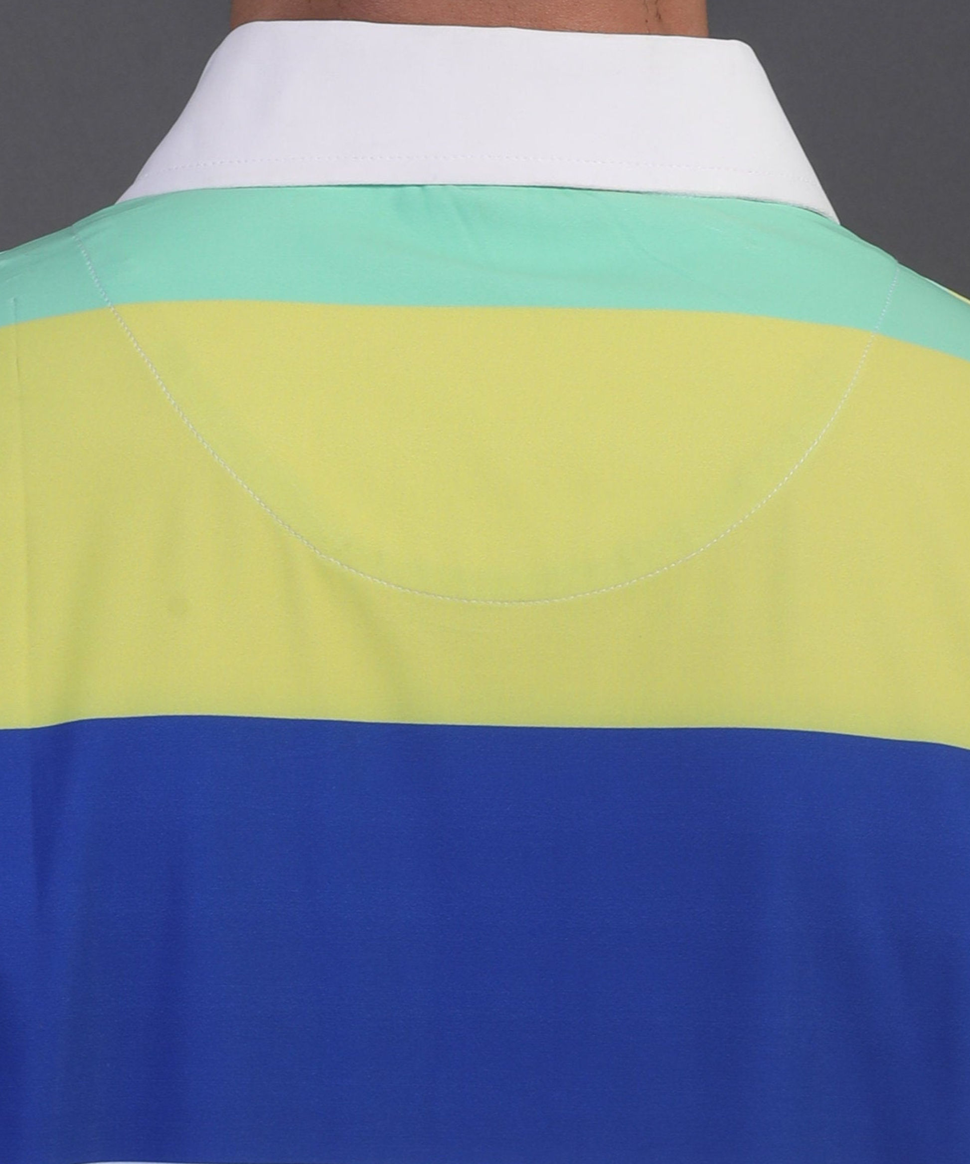High quality DapperTee firm collar construction on yellow blue white green polo.