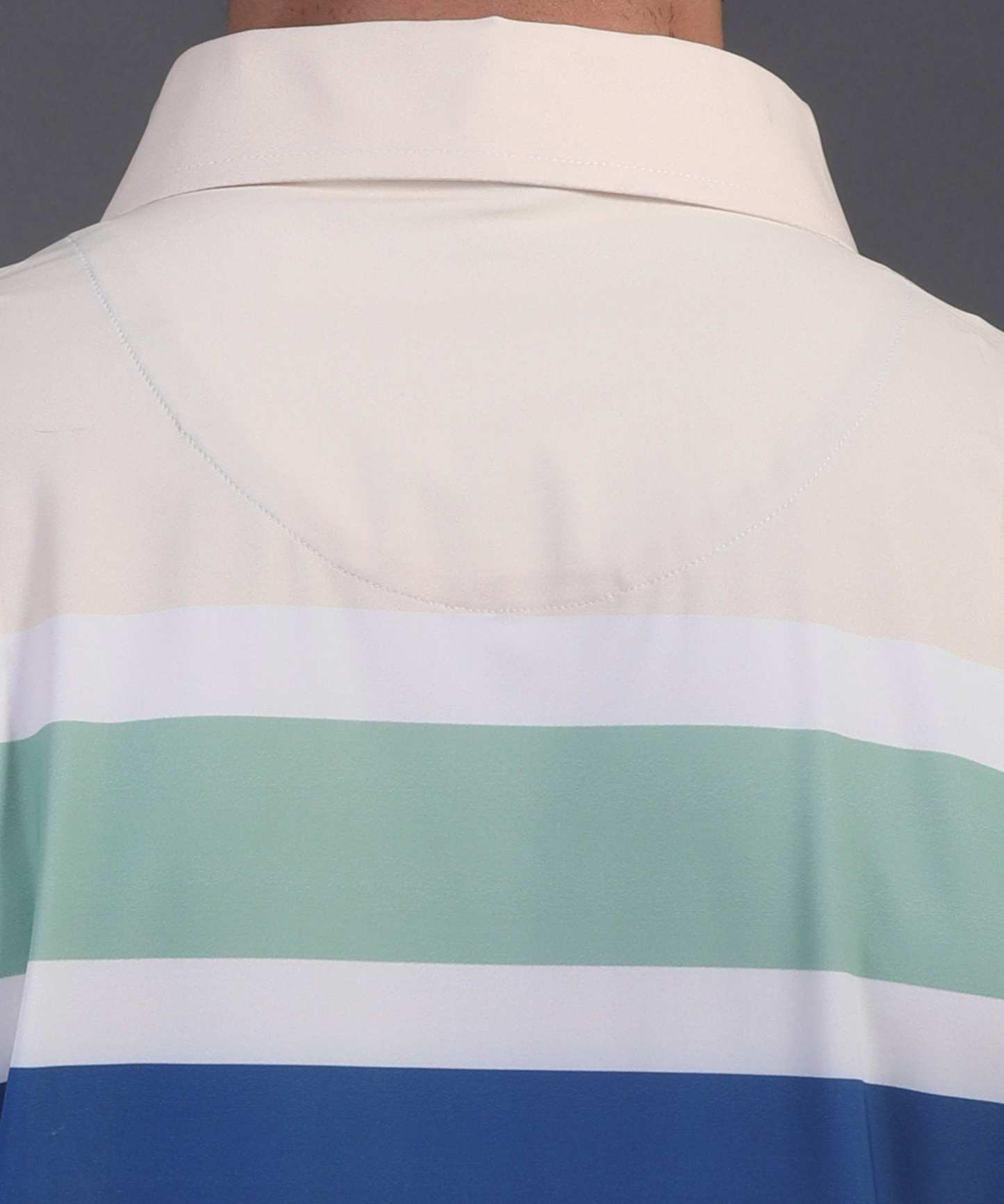 High quality DapperTee firm collar construction on white blue red golf polo.