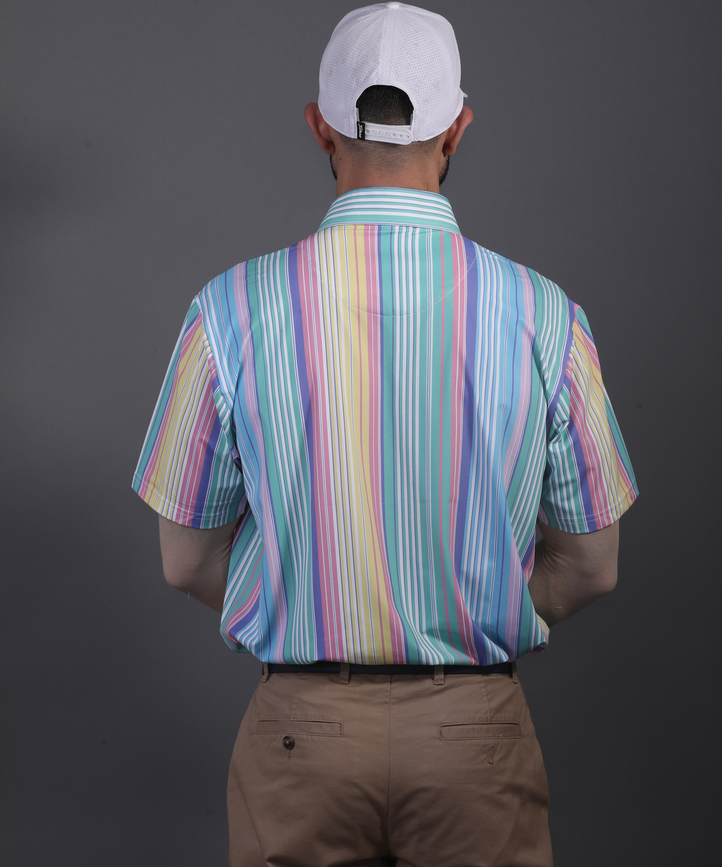 Rear view of DapperTee striped polo demonstrating athletic fit and stretchable comfort.