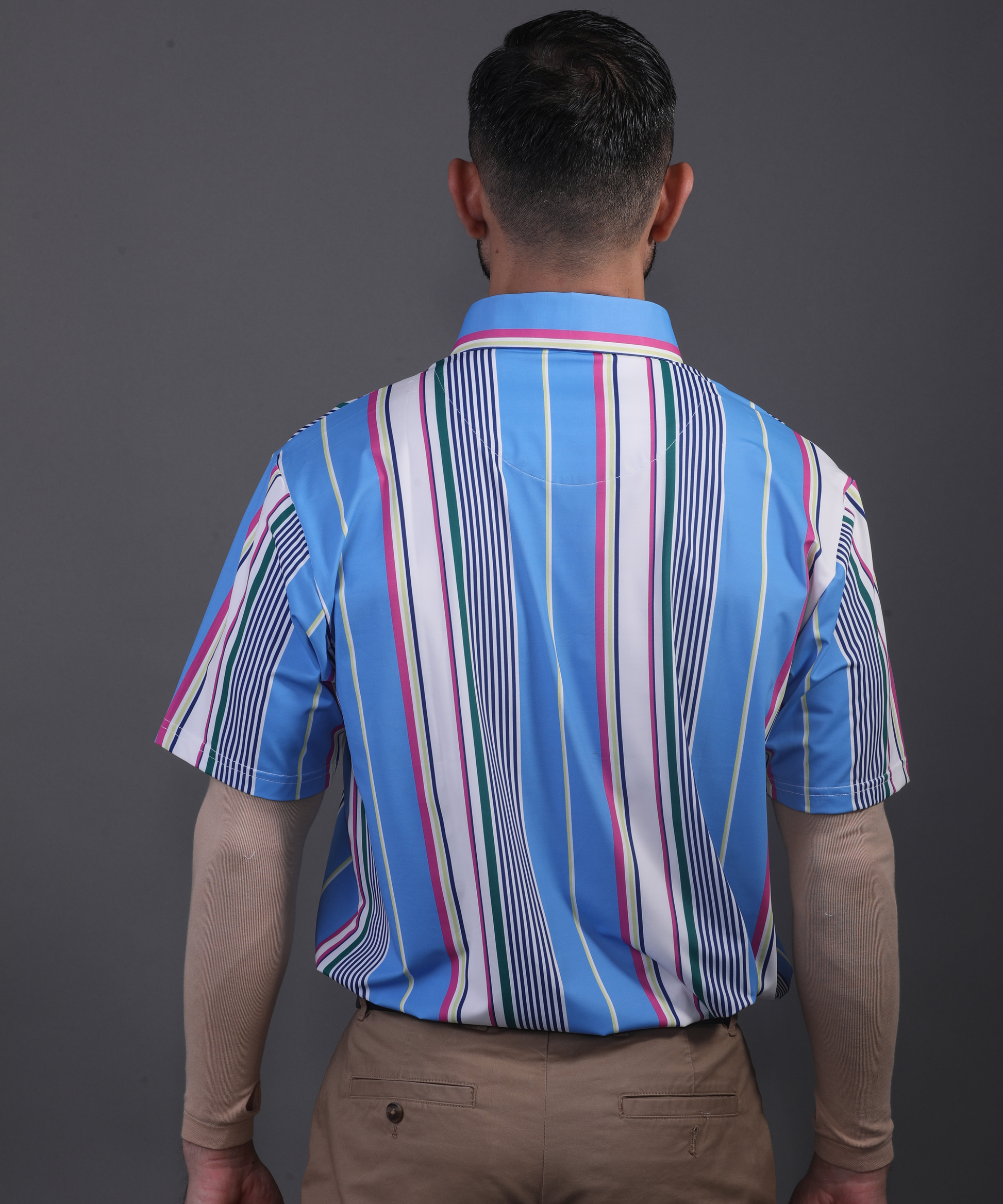 Full back view DapperTee blue stripe polo for professional men's golf style.