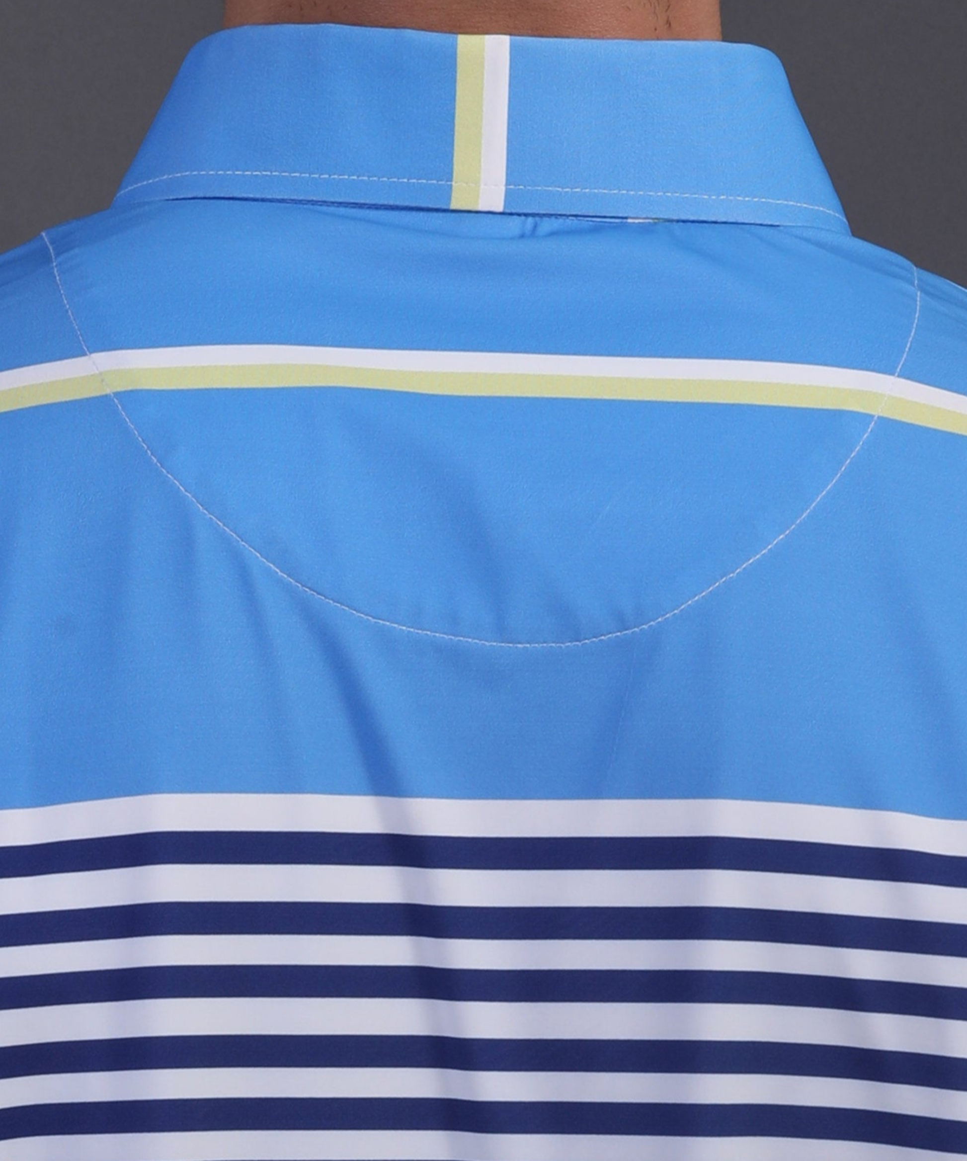 High-quality DapperTee firm collar construction on light blue striped professional golf polo