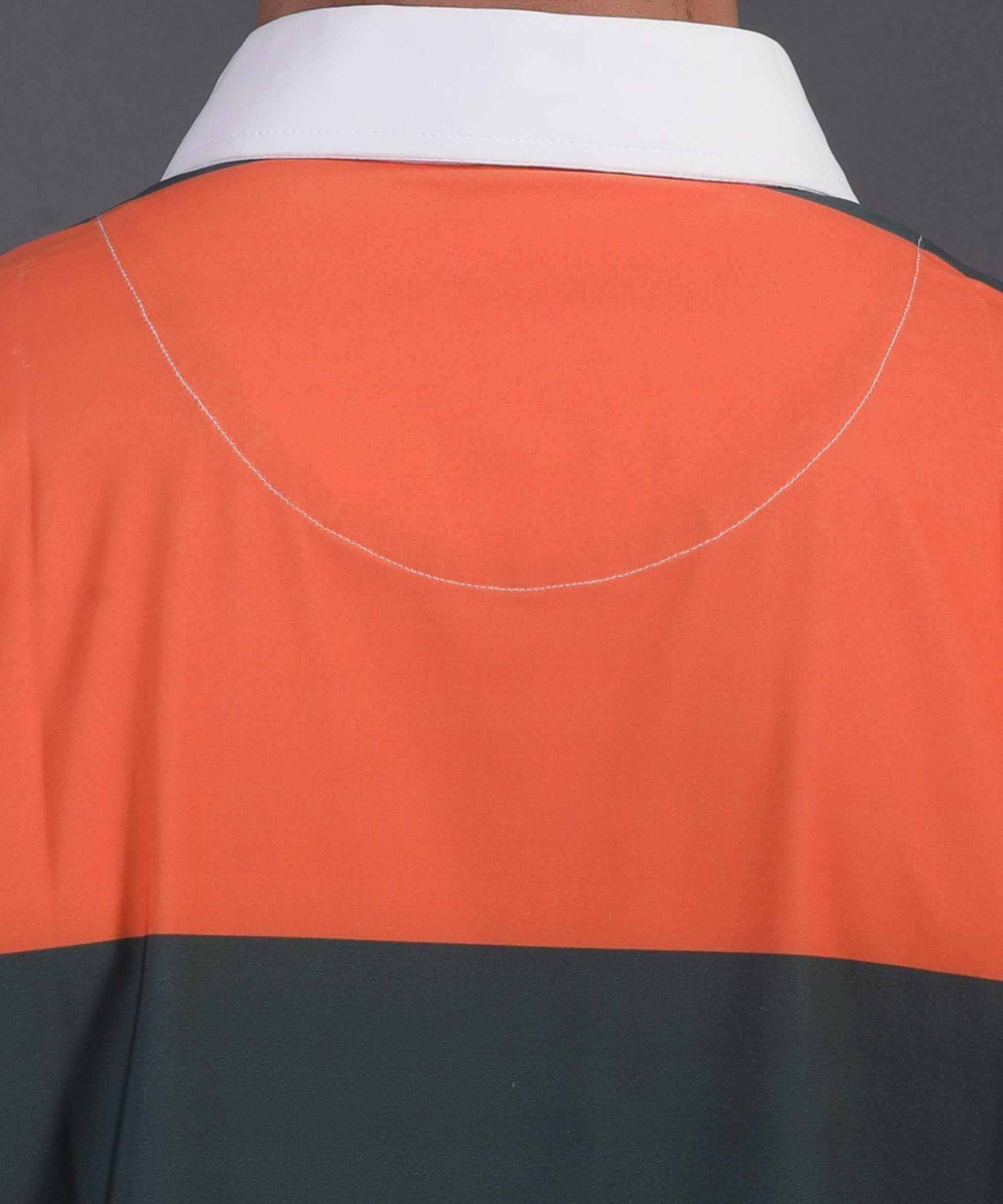 High quality DapperTee firm collar construction on orange green blue striped polo.