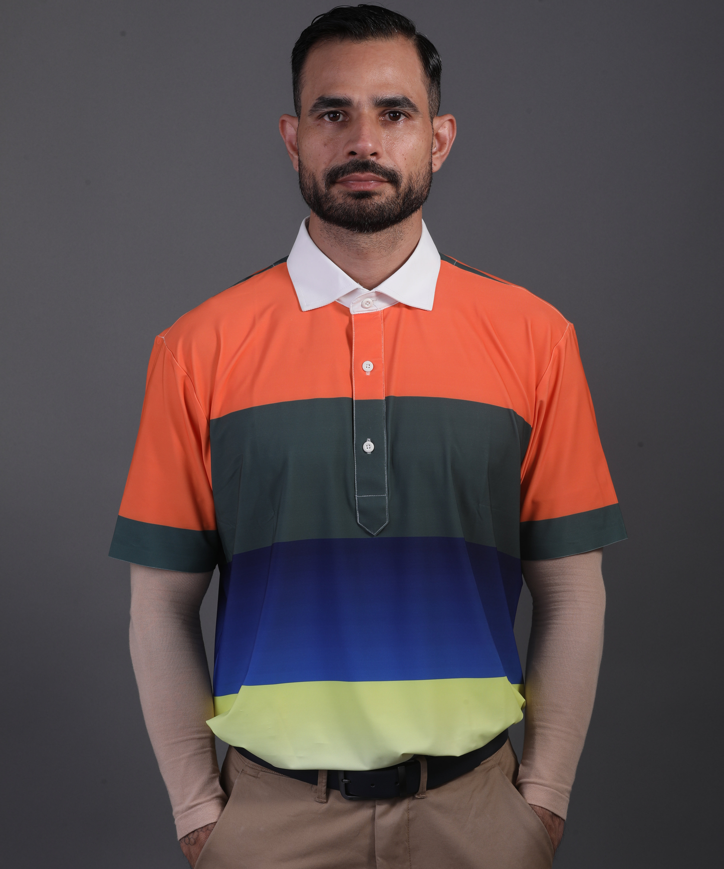 Well groomed model wearing DapperTee Pure Essential polo for premium golf aesthetic.