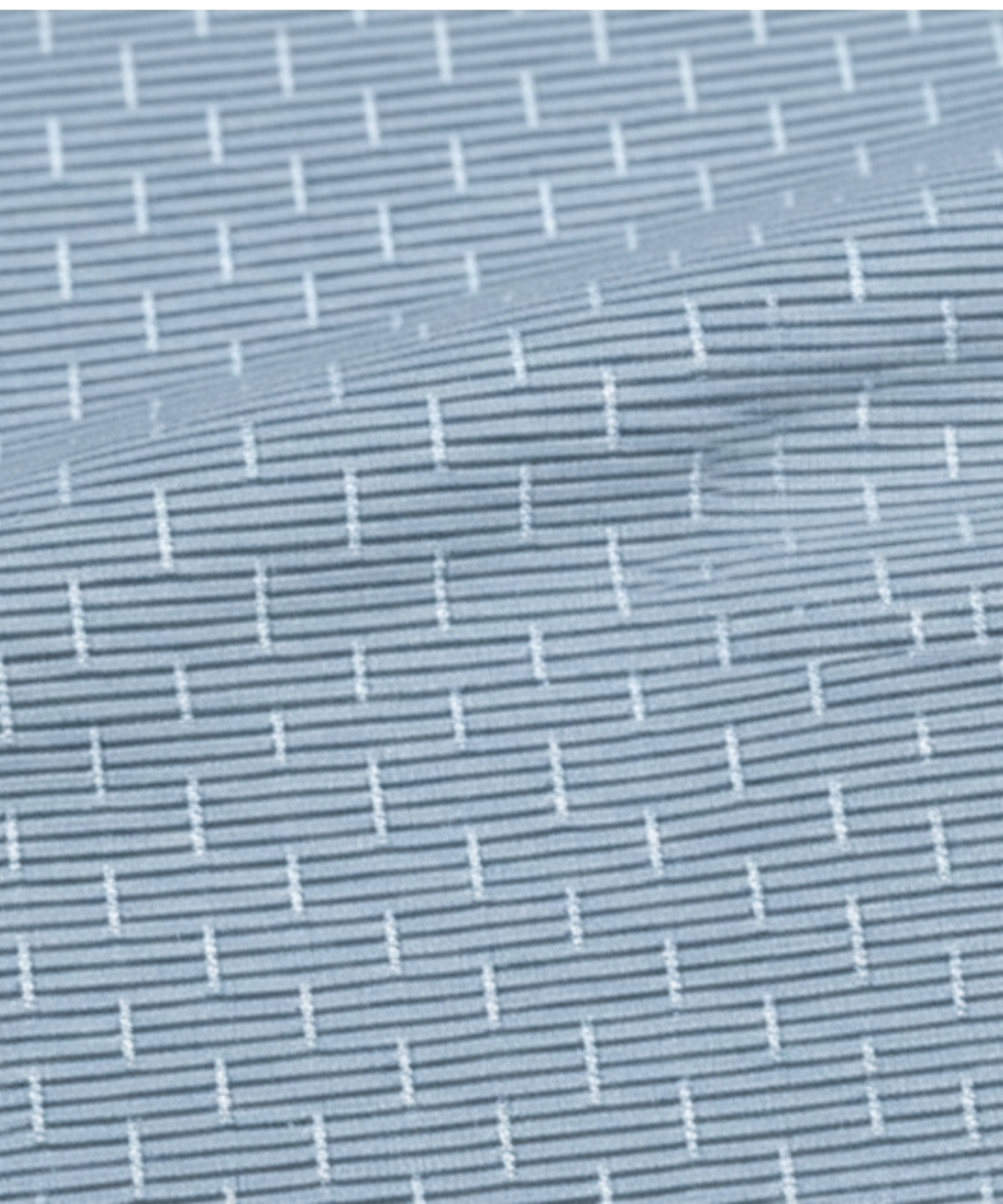 Close-up specialized jacquard polyamide fabric texture on DapperTee Swede Sea blue shirt.