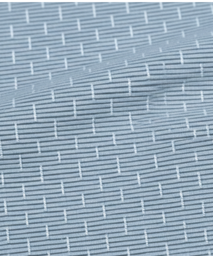 Close-up specialized jacquard polyamide fabric texture on DapperTee Swede Sea blue shirt.