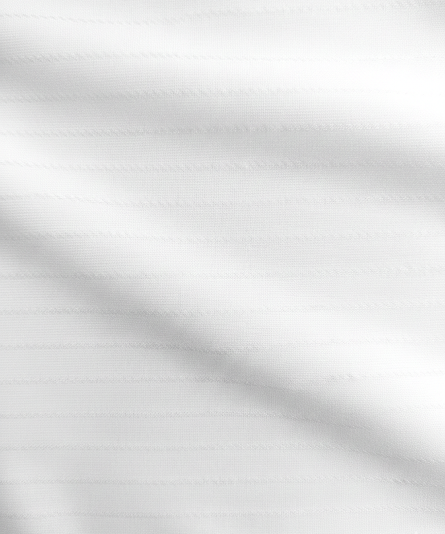 Close-up specialized striper jacquard polyamide fabric texture on DapperTee white office polo.
