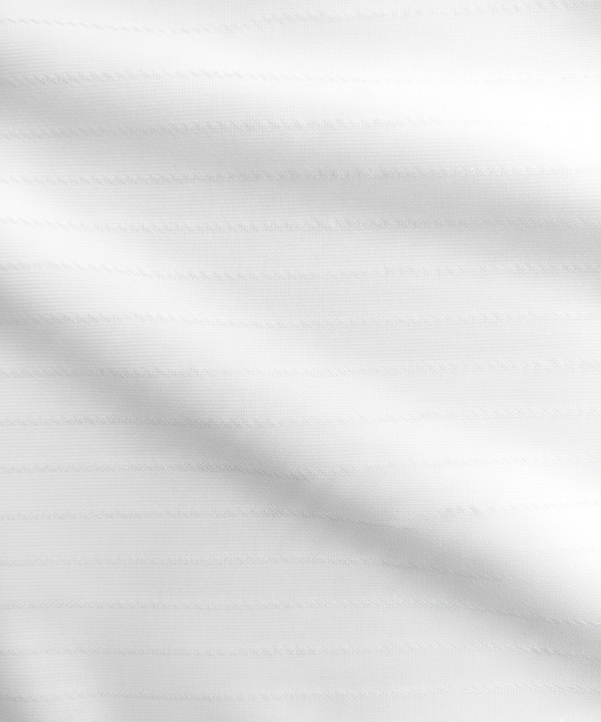Close-up specialized striper jacquard polyamide fabric texture on DapperTee white office polo.