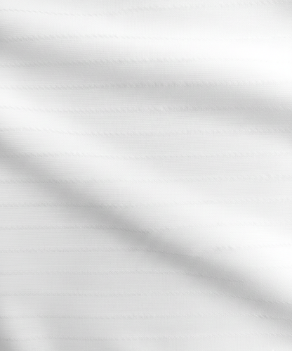 Close-up specialized striper jacquard polyamide fabric texture on DapperTee white office polo.
