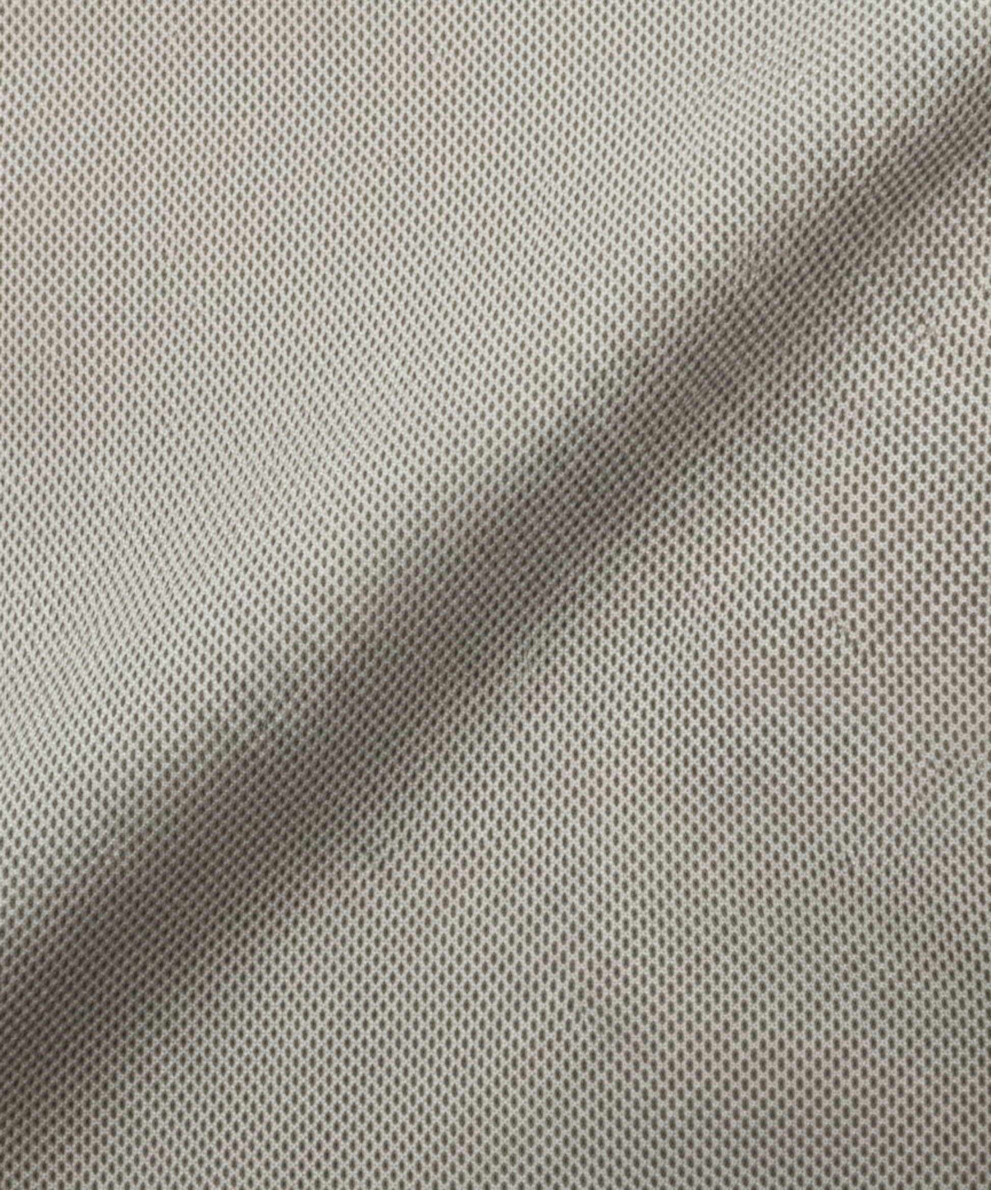 Close-up specialized jacquard polyamide fabric texture on DapperTee Netherland khaki office polo.