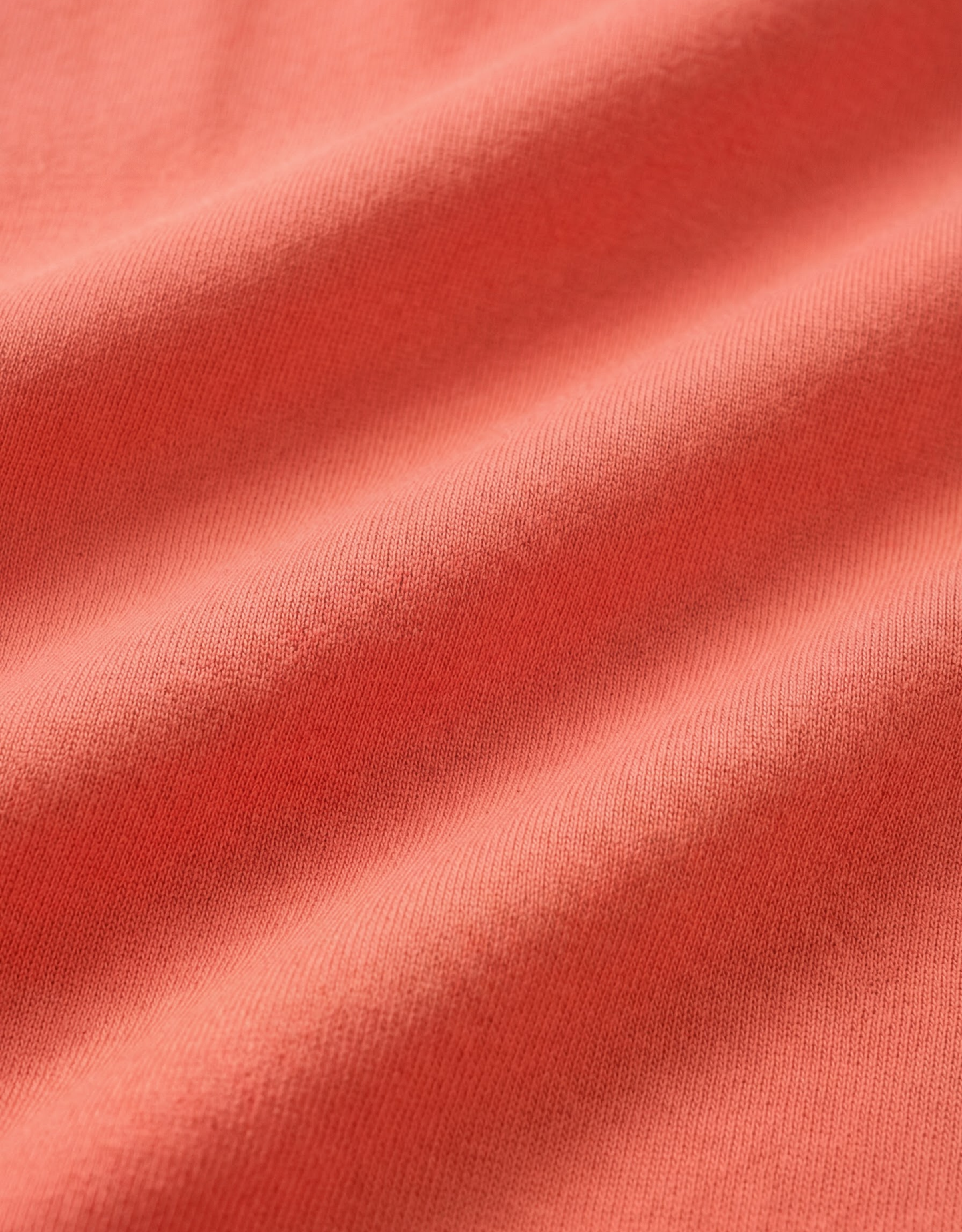 Close-up specialized polyamide fabric texture on DapperTee Japan Sun rust office polo.