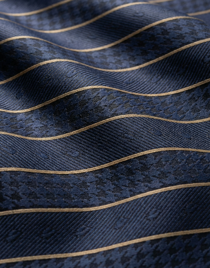 Close-up specialized polyamide fabric texture on DapperTee Afrikaans Ultra gold stripe polo.
