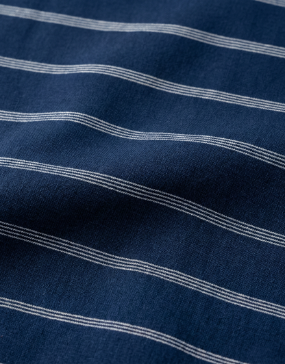 Close-up specialized polyamide fabric texture on DapperTee French Navy striped office polo.