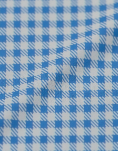 Close-up specialized polyamide fabric texture on DapperTee Financial London checked office polo.