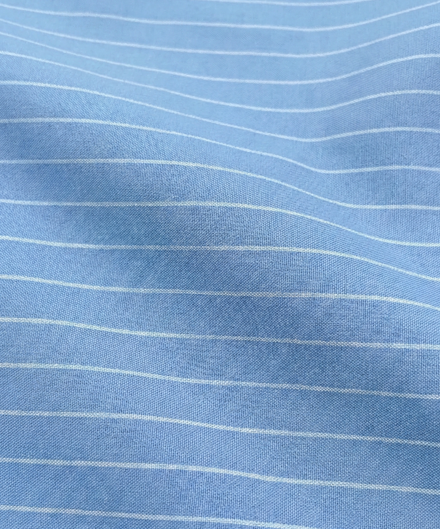 Close-up specialized jacquard polyamide fabric texture on DapperTee Danish Sea blue shirt.